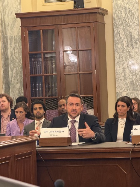 A professional Camp Bow Wow franchisee discussing small business legislation and owner protections.